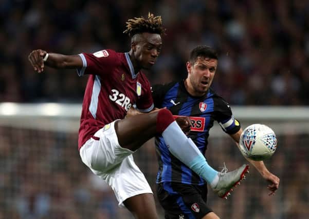 Aston Villa's Tammy Abraham (left) and Rotherham United's Richard Wood battle for the ball.