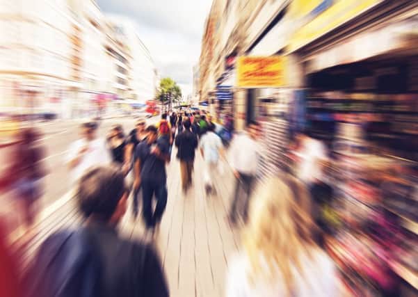 ADOBE STOCK
People shopping and walking in London Oxford street - radial zoom effect defocusing filter applied, with vintage instagram look
