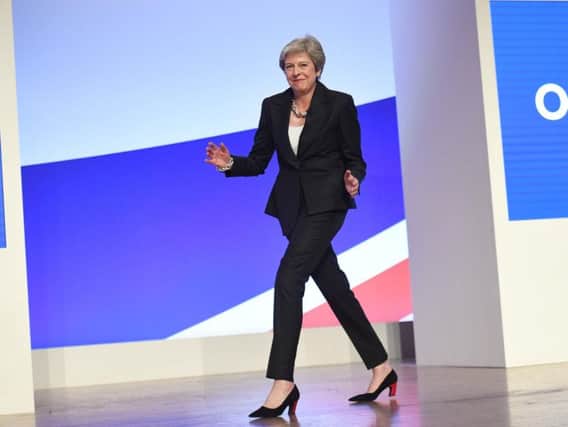 Prime Minister Theresa May began her Conservative Party conference speech by dancing on stage to ABBA's Dancing Queen.