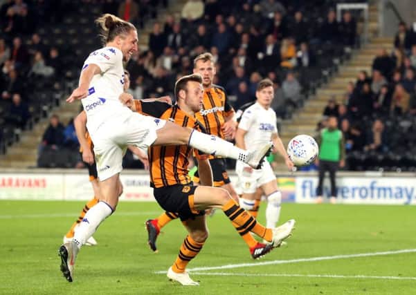Leeds United's Luke Ayling and Hull City's Evandro Goebel battle for the ball (Pictures: PA)