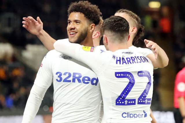 Leeds United's Tyler Roberts (left) celebrates scoring his side's first goal at Hull (Picture: PA)