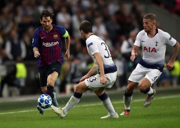 Tottenham Hotspur's Ben Davies and Barcelona's Lionel Messi during the UEFA Champions League, Group B match at Wembley Stadium, London. (Pictures: PA)