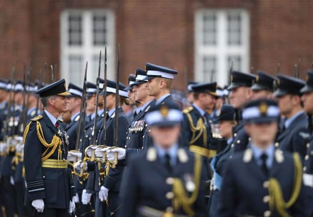 Chief of the Air Staff, Air Chief Marshal Sir Stephen Hillier (left) reviews ranks of officers and airmen during a joint graduation at RAF College Cranwell in Lincolnshire.