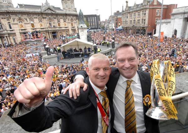 Goalscoring hero Dean Windass with chairman Paul Duffen during the celebrations 10 years ago after  Hull City won the play-off final at Wembley to reach the Premier League (Picture: Terry Carrott).