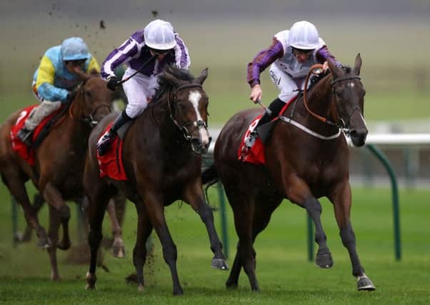 Laurens ridden by Daniel Tudhope (right) wins the Kingdom Of Bahrain Sun Chariot Stakes ahead of Happily.