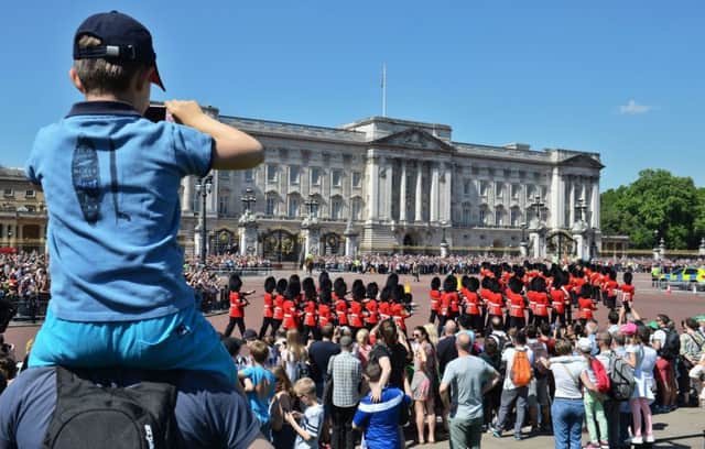 Tourists watching the Changing the Guard ceremony outside Buckingham Palace