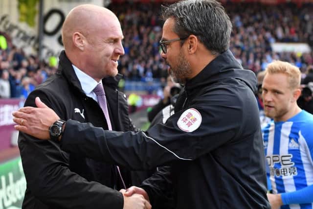 Burnley manager Sean Dyche (left) and Huddersfield Town manager David Wagner exchange pleasantries at Turf Moor on Saturday. Picture: Anthony Devlin/PA