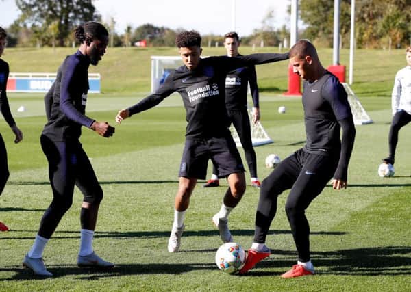 England's Nathaniel Chalobah (left to right), Jadon Sancho and Ross Barkley during the training session at St George's Park, Burton. Picture: Martin Rickett/PA