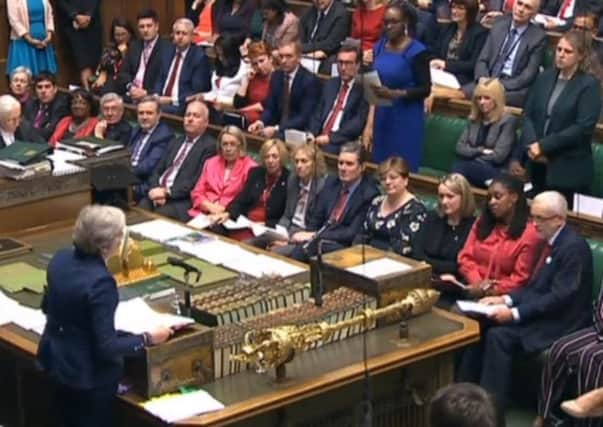 Theresa May and Jeremy Corbyn clash at PMQs over austerity.