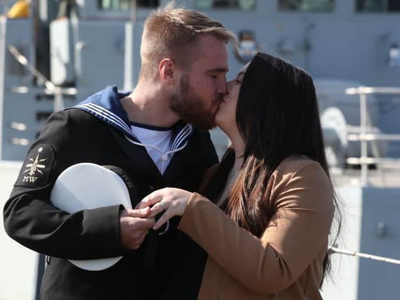 Military families are affected by long deployments, a charity has warned. Pictured in August, Able Seaman Joshua Bertman proposed to Hazel Staunton on the dock at HM Naval Base Clyde after arriving back after deployment with the Royal Navy mine hunter HMS Bangor in the Gulf. Photo: Andrew Milligan/PA Wire