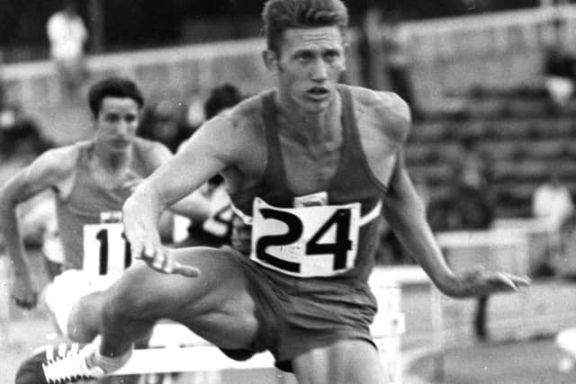 John Sherwood competing the in 400m hurdles.