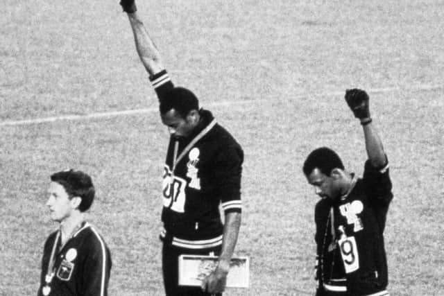 American sprinters Tommie Smith and John Carlos raise their fists and give the Black Power Salute at the 1968 Olympic Games in Mexico City. The move was a symbolic protest against racism in the United States. Smith, the gold medal winner, and Carlos, the bronze medal winner, were subsequently suspended from their team for their actions. (Picture: Bettmann/CORBIS)