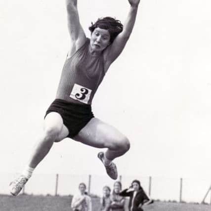 Sheila Sherwood competing in the long jump in 1972