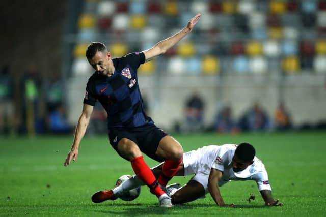 Croatia's Ivan Perisic (left) and England's Marcus Rashford (right) battle for the ball in Rijeka. Picture: Tim Goode/PA