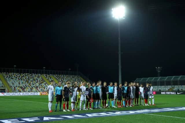England and Croatia players and match officials pose for a photograph before kick-off in a near-empty Stadion HNK Rijeka. Picture: Tim Goode/PA