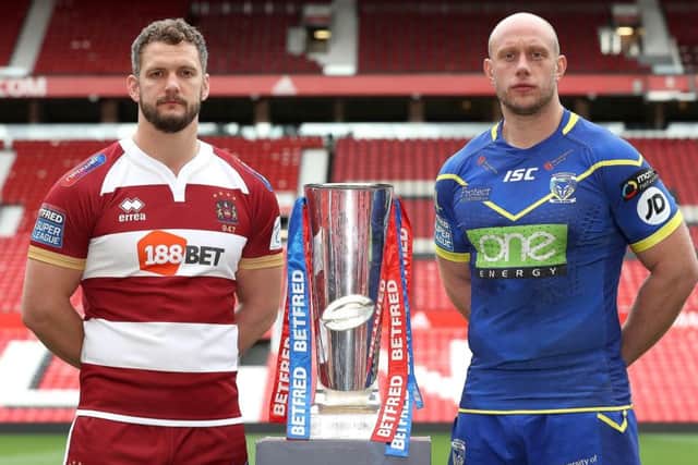 GRAND OCCASION: Wigan Warriors Sean O'Loughlin (left) and Warrington Wolves' Chris Hill will lead their teams out in Saturday's Grand Final at Old Trafford. Picture: Martin Rickett/PA