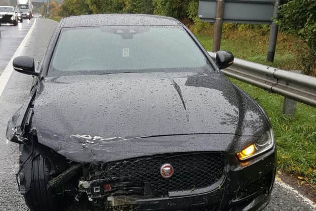 A smashed up Jaguar which came a-cropper in the rain today. Photo: West Yorkshire Police