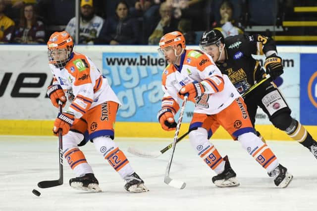TOUGH GOING: Kieran Brown, left, is supported by Brendan Brooks as the Sheffield Steelers look for a way back into the game at the National Ice Centre. Picture: Panthers Images