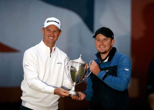 British Masters host Justin Rose presents the trophy to Eddie Pepperell after his victory at Walton Heath (Picture: Steven Paston/PA Wire).