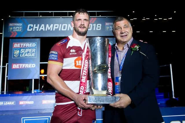 Wigan's Sean O'Loughlin and coach Shaun Wane with the Betfred Super League Trophy after victory over Warrington.
