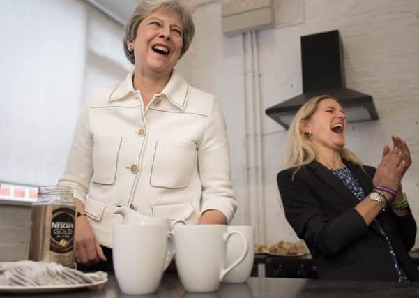 Tea for two? Theresa May launches the Government's loneliness strategy with Kim Leadbeater, the sister of murdered MP Jo Cox.
