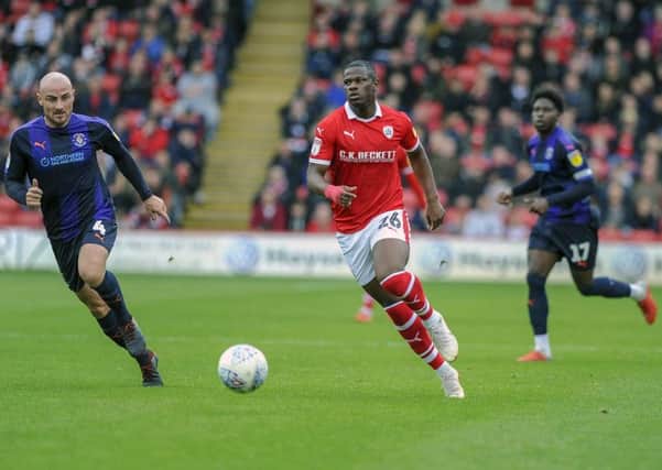 Taking on the Hatters: Barnsley striker Mamadou Thiam.