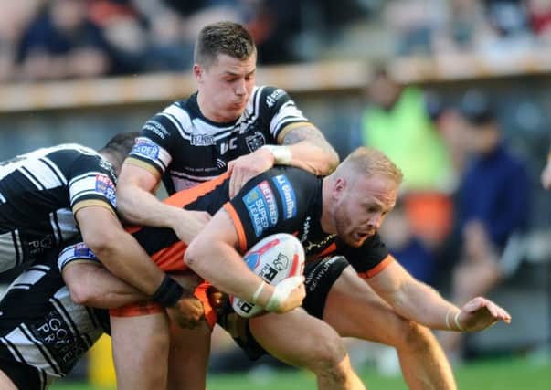 Betfred Super League.
Hull FC v Castleford Tigers.
Castleford's Oliver Holmes is tackled by Hull's Danny Houghton, Sika Manua and Jamie Shaul.
Picture Jonathan Gawthorpe
5th May 2018.