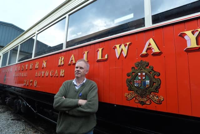 Steve Middleton with the restored 1903 carriage.