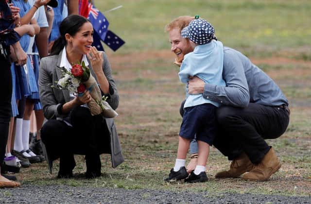 The Duke and Duchess of Sussex talk to Luke Vincent, 5, after arriving at Dubbo airport, in Australia, on the second day of their tour to the country.