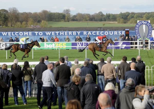 Kapgarry beats I Just Know on the opening day of the National Hunt Season at Wetherby.   Picture by Simon Hulme