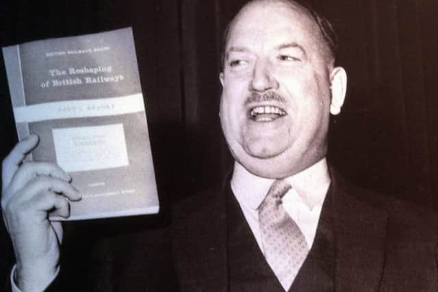 Dr Richard Beeching with his report, in 1963, that led to the closure of railway lines.