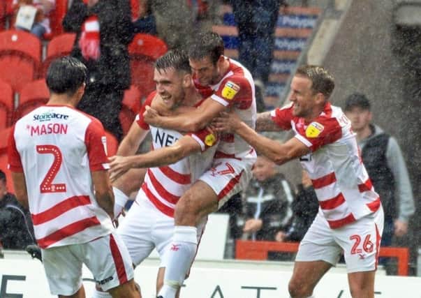 PROMISING: Doncaster Rovers' players celebrate Ben Whiteman's winning goal against Luton Town.