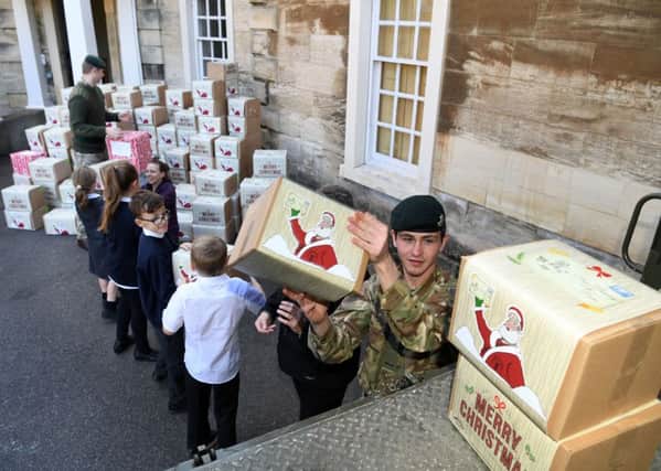 Soldiers arrive at Cusworth Hall Museum in Doncaster to collect comfort packs from Sandringham Primary School pupils, for soldiers in the Middle East.