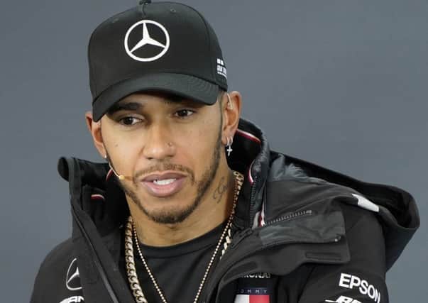 Mercedes driver Lewis Hamilton, of Britain, speaks during a news conference for the Formula One U.S. Grand Prix. (AP Photo/Darren Abate)