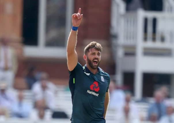 England's Liam Plunkett celebrates taking the wicket of India's Lokesh Rahul during the second Royal London one day international match at Lord's, London.