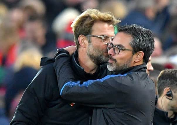 Huddersfield Town head coach David Wagner embraces good friend and Liverpool counterpart Jurgen Klopp after the match at Anfield last October (Picture: Dave Howarth/PA Wire).