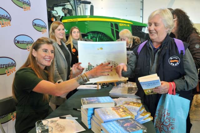 Yorkshire Shepherdess Amanda Owen signing copies of her books at Countryside Live at the Great Yorkshire Showground in Harrogate.