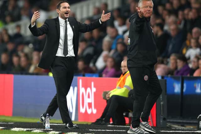 Derby County manager Frank Lampard, left, appeals with Sheffield United's Chris Wilder nonplussed. CREDIT: Nigel French/PA Wire