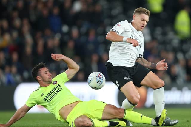 Derby County's Martyn Waghorn (right) and Sheffield United's Enda Stevens battle for the ball CREDIT: Nigel French/PA Wire