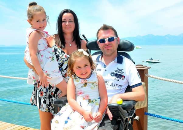 Jason Liversidge with wife Liz and daughters Poppy and Lilly