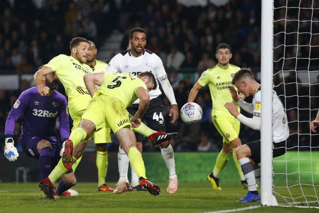 SO CLOSE: Sheffield United's Jack O'Connell has a header cleared off the line by Derby's Mason Mount at Pride Park. Picture: Simon Bellis/Sportimage