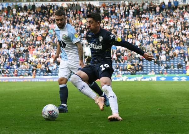 United's Pablo Hernandez takes on Rovers Adam Armstrong.
