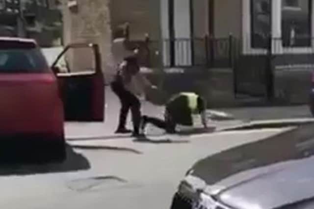 A still from the footage in which the police officer was attacked by a drug addict