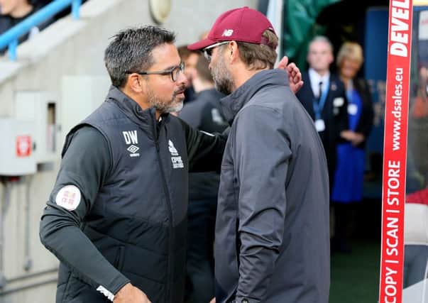 Huddersfield Town manager David Wagner (left) and Liverpool boss Jurgen Klopp before the Premier League match at the John Smith's Stadium. Picture: Richard Sellers/PA