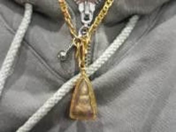 The gold pendant stolen in the burglary of a Scarborough house