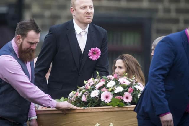Malcolm Willsher (centre) takes the coffin of his wife, Jodie, who was stabbed to death as she worked in a supermarket, in to Christ Church in Skipton ahead of her funeral. Photo: PA