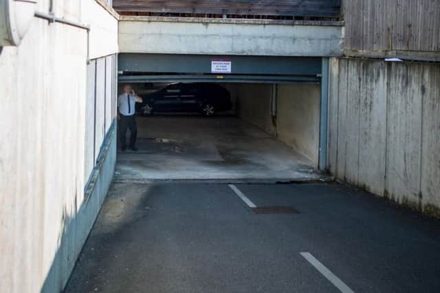 The garage door in which the woman died. Photo: SWNS