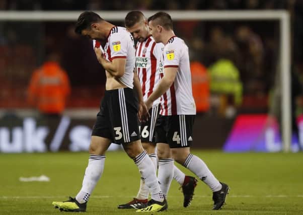 A frustrated Enda Stevens walks off with John Fleck and Oliver Norwood at Bramall Lane.   Picture: Simon Bellis/Sportimage