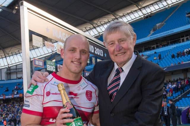 Hull legend Johnny Whiteley, right, presents Hull KR's Michael Dobson with the man-of-the-match at Magic Weekend in 2013 (SWPix)