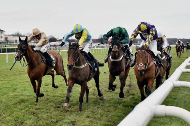 Wakanda, second left, and Henry Brooke win the Sky Bet Chase under Henry Brooke.